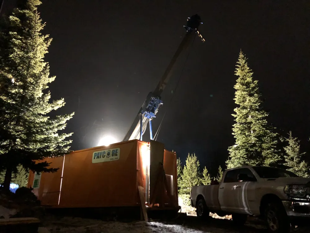 Paycore drill shack and tower lit up at night